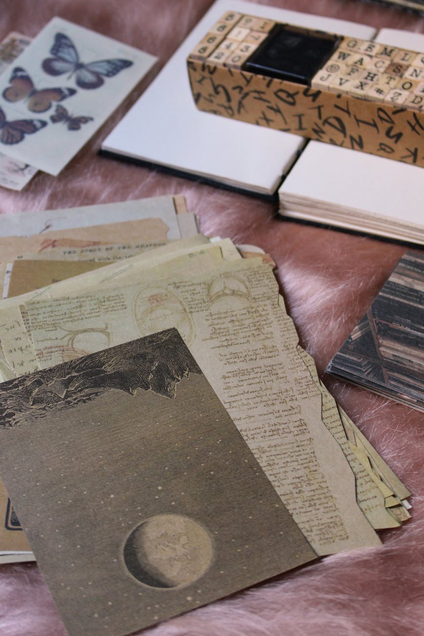 an aesthetic flat lay with journaling or scrapbooking materials papers and junk